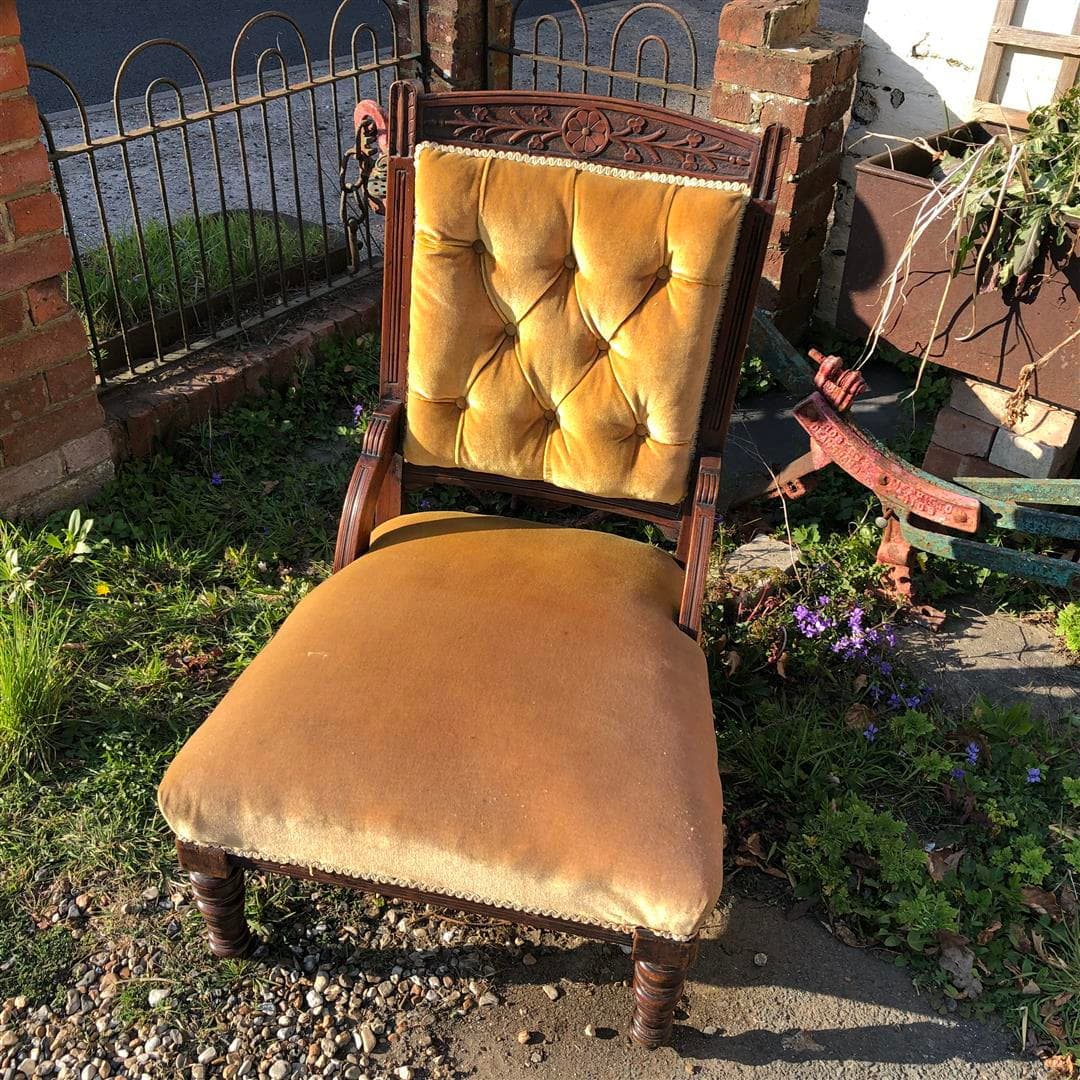 Antique low nursing chair with yellow upholstery 1910s